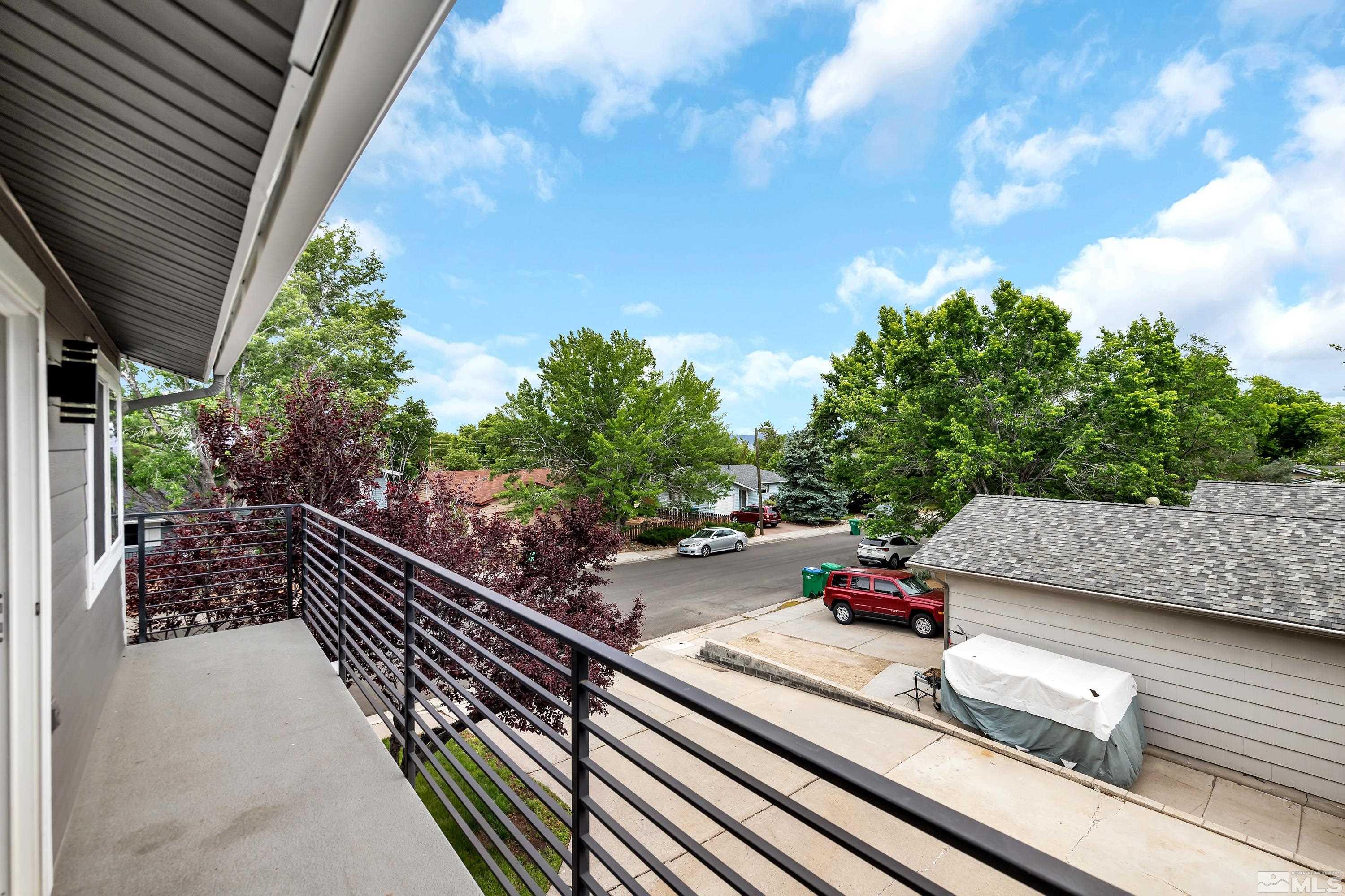 1415 Ebbetts Drive Reno, NV 89503 - Photo 33 of 36 a street view with sitting space and trees in the background