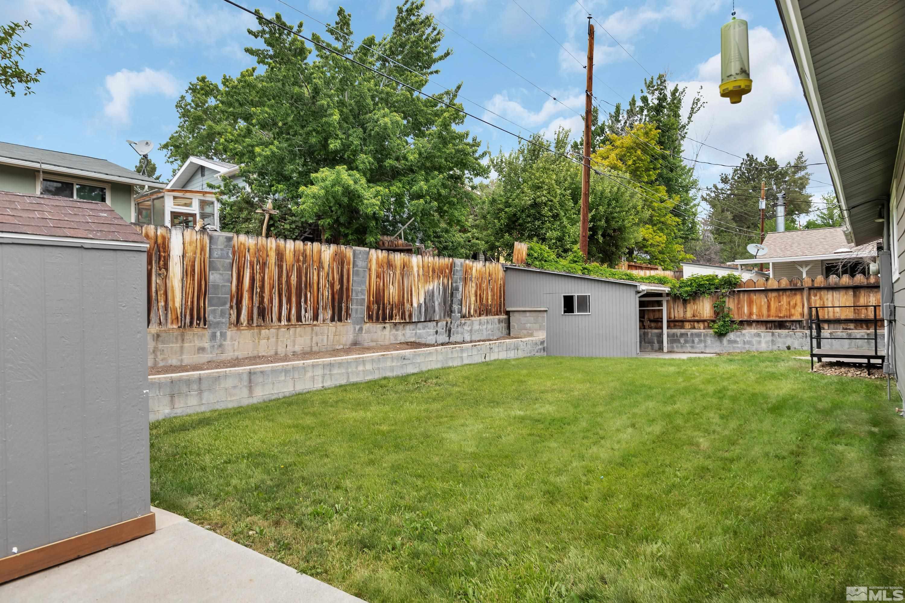 1415 Ebbetts Drive Reno, NV 89503 - Photo 35 of 36 a view of backyard with a garden and deck
