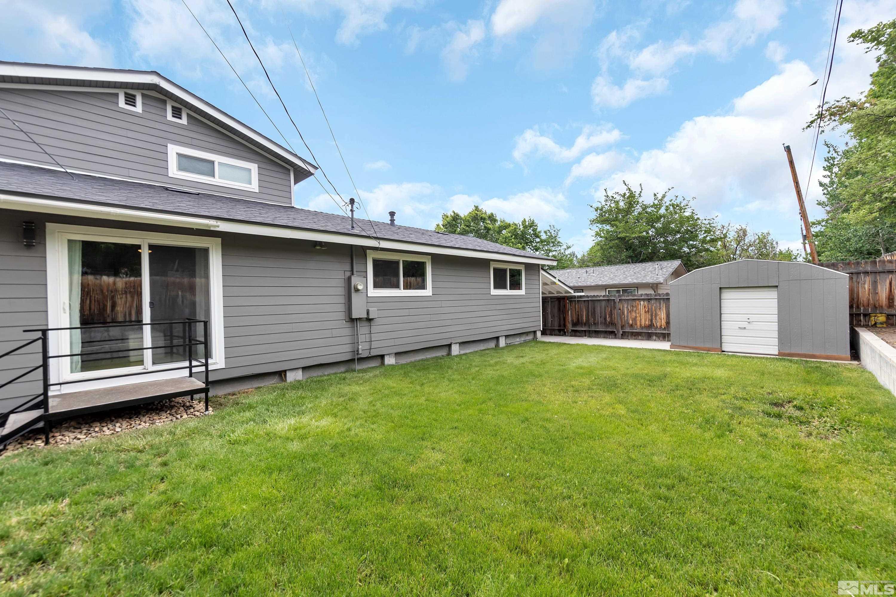 1415 Ebbetts Drive Reno, NV 89503 - Photo 36 of 36 a backyard of a house with oven a table and chairs