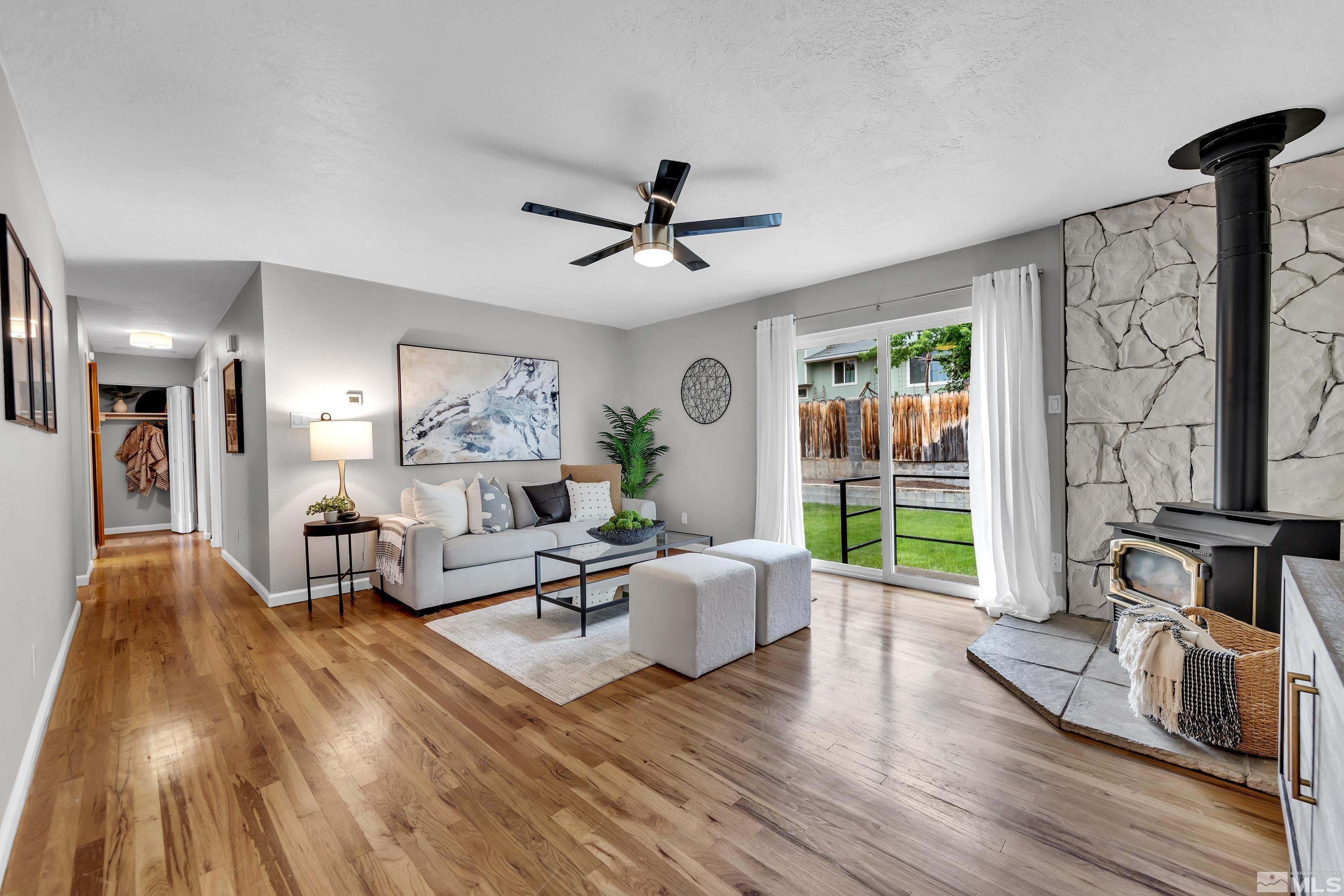 1415 Ebbetts Drive Reno, NV 89503 - Photo 4 of 36 a living room with furniture and a wooden floor