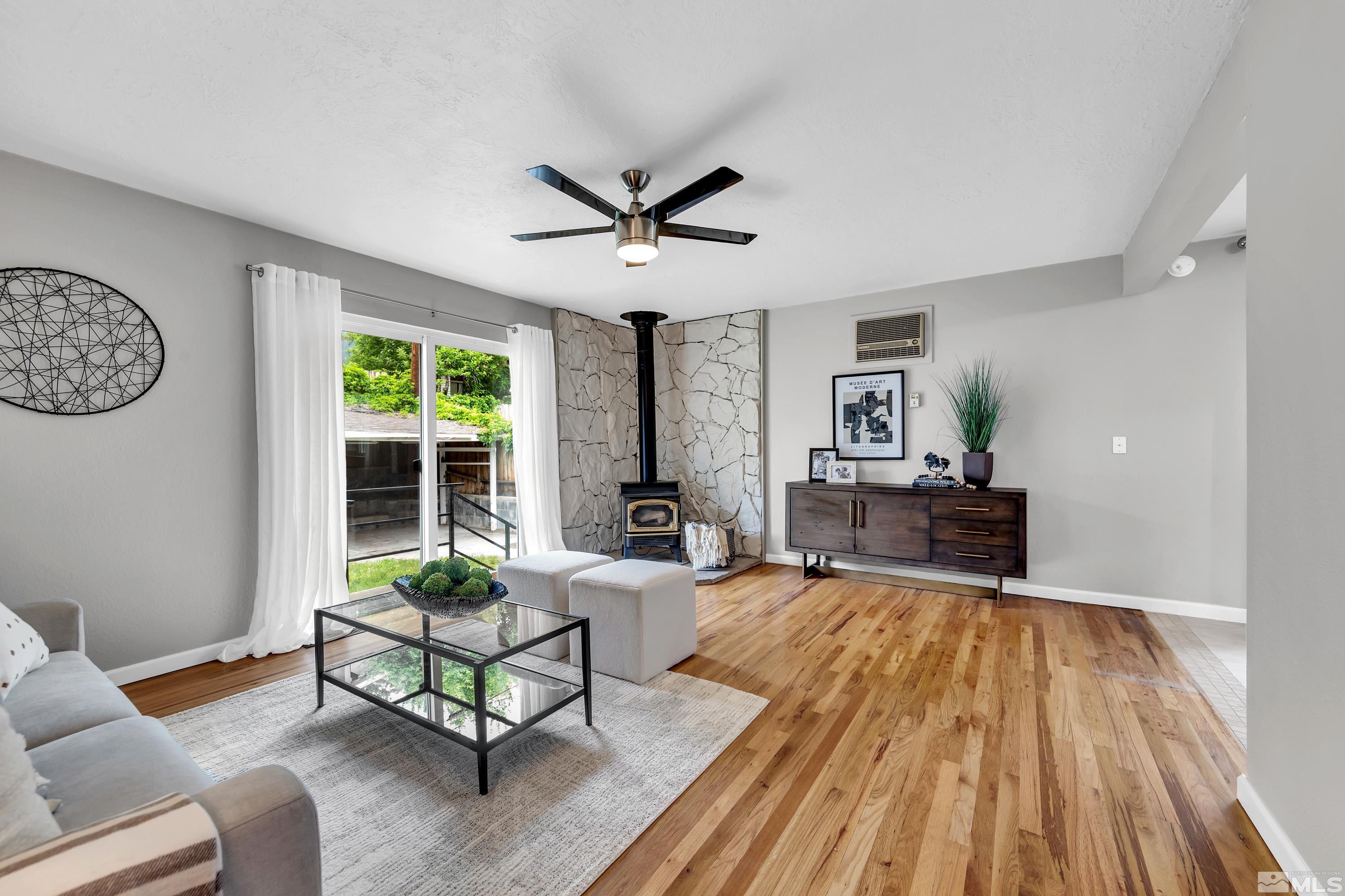 1415 Ebbetts Drive Reno, NV 89503 - Photo 5 of 36 a living room with furniture and a wooden floor