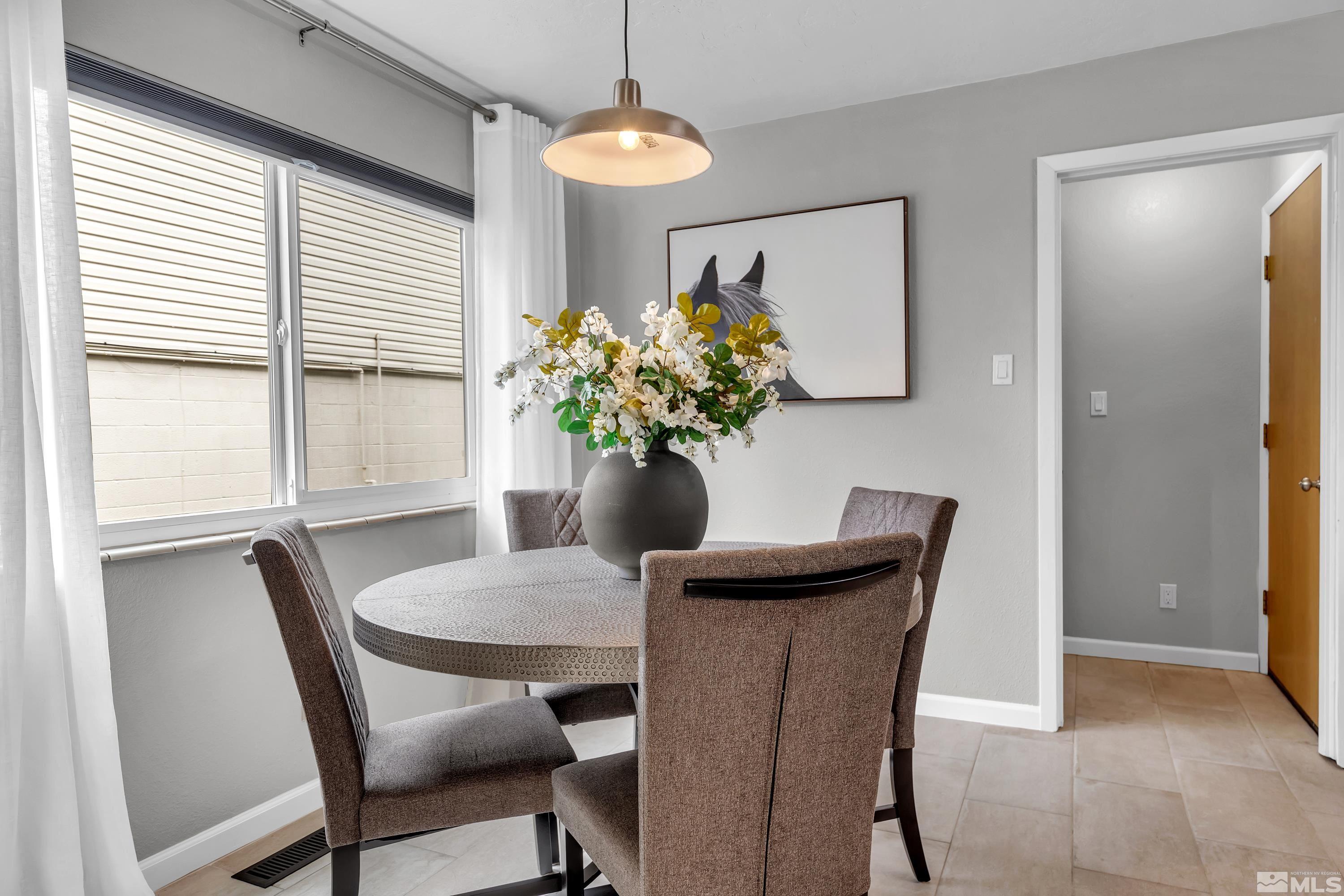 1415 Ebbetts Drive Reno, NV 89503 - Photo 8 of 36 a dining room with furniture and window
