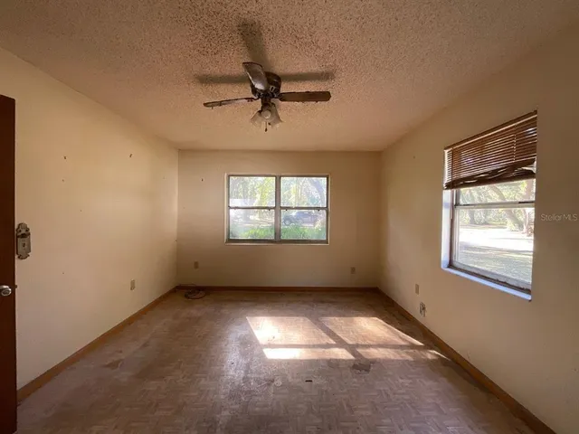 a view of empty room with windows
