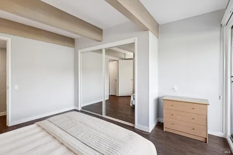 a bathroom with a sink vanity mirror and toilet