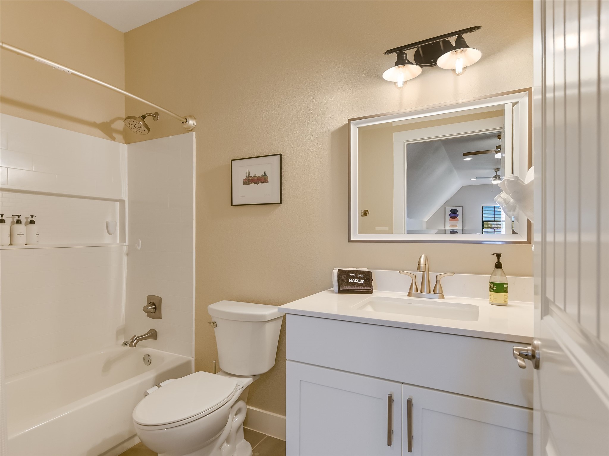 19819 Lockwood Road Manor, TX 78653 - Photo 21 of 29 Attached to the upstairs retreat, this full bath ensures guests or family enjoy comfort, privacy, and the convenience of an entirely self-contained space.