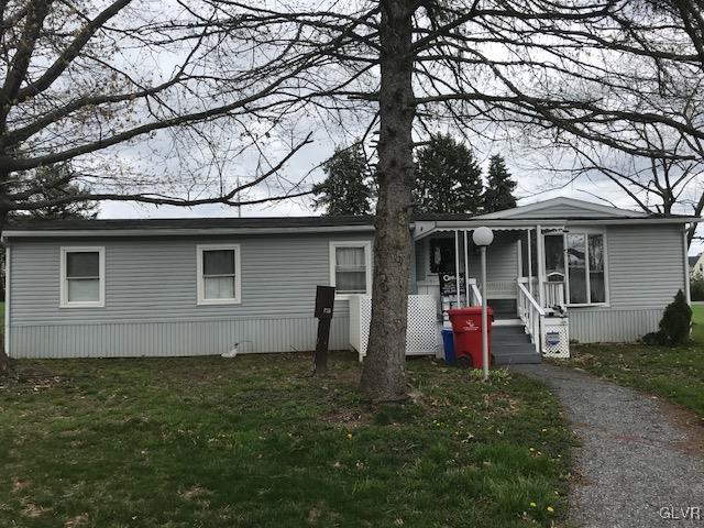 8859 Turkey Ridge Road Breinigsville, PA 18031 - Photo 3 of 11 a front view of a house with garden