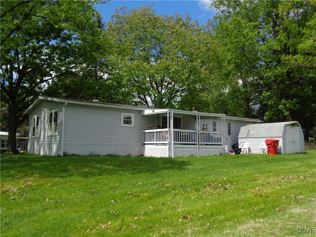 8859 Turkey Ridge Road Breinigsville, PA 18031 - Photo 4 of 11 a view of a house with a yard