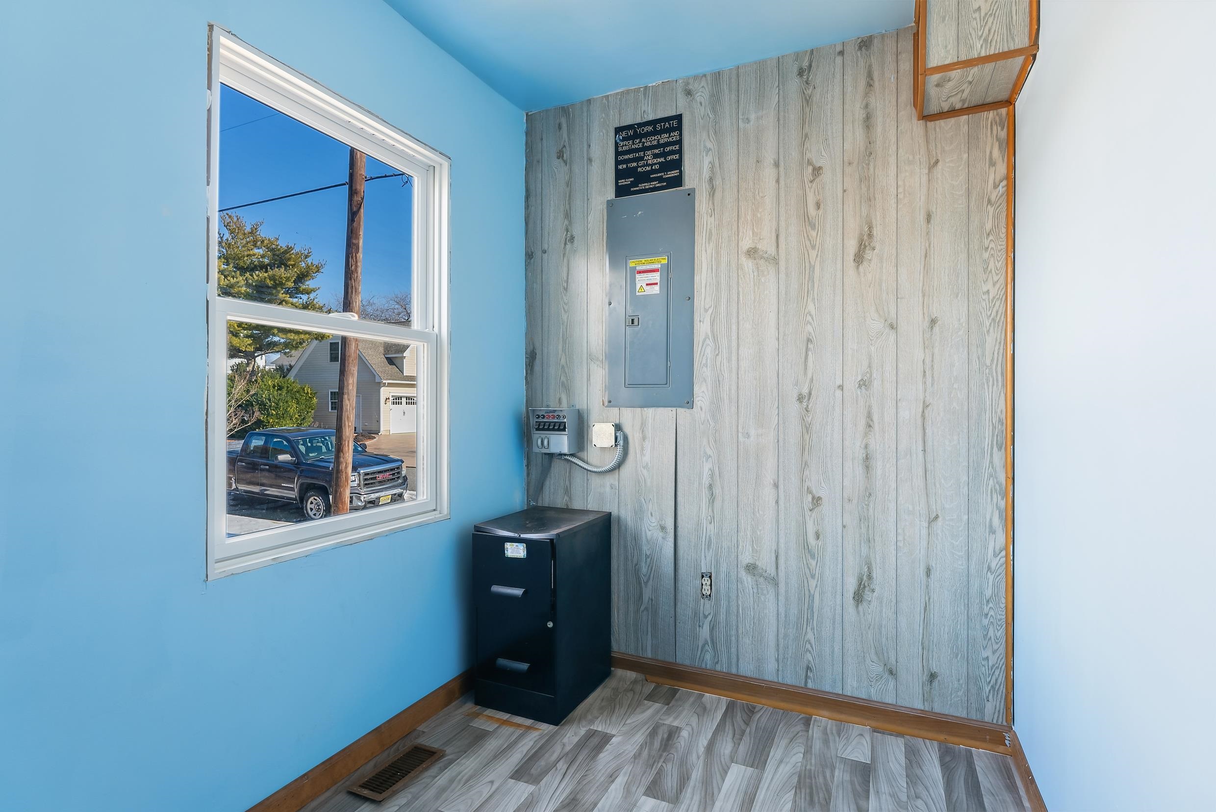 401 4th West Cape May, NJ 08204 - Photo 13 of 43 a view of a hallway with wooden floor and a bathroom