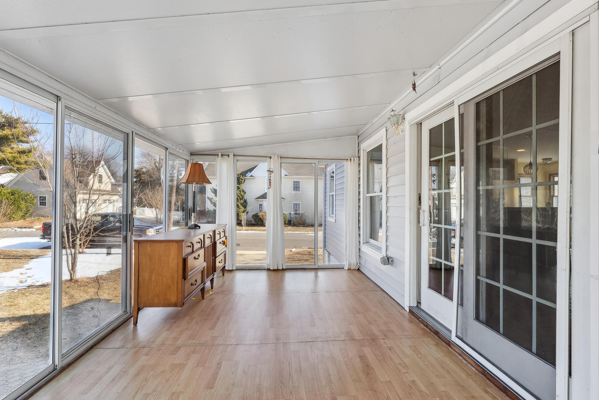 401 4th West Cape May, NJ 08204 - Photo 14 of 43 a view of a large room with wooden floor and windows