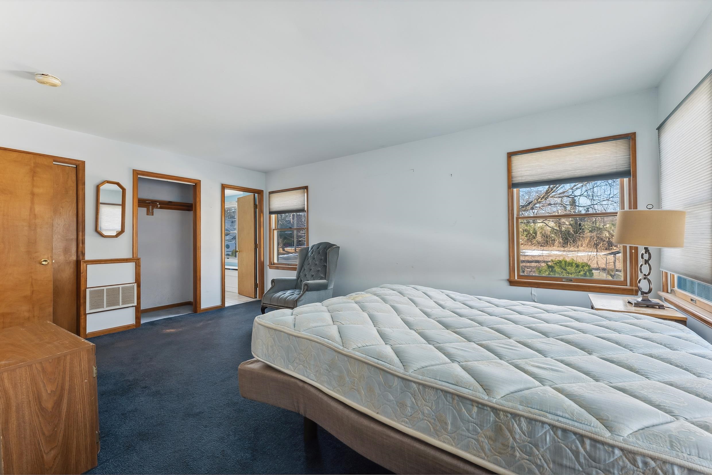 401 4th West Cape May, NJ 08204 - Photo 18 of 43 a bedroom with a bed and dresser next to a window