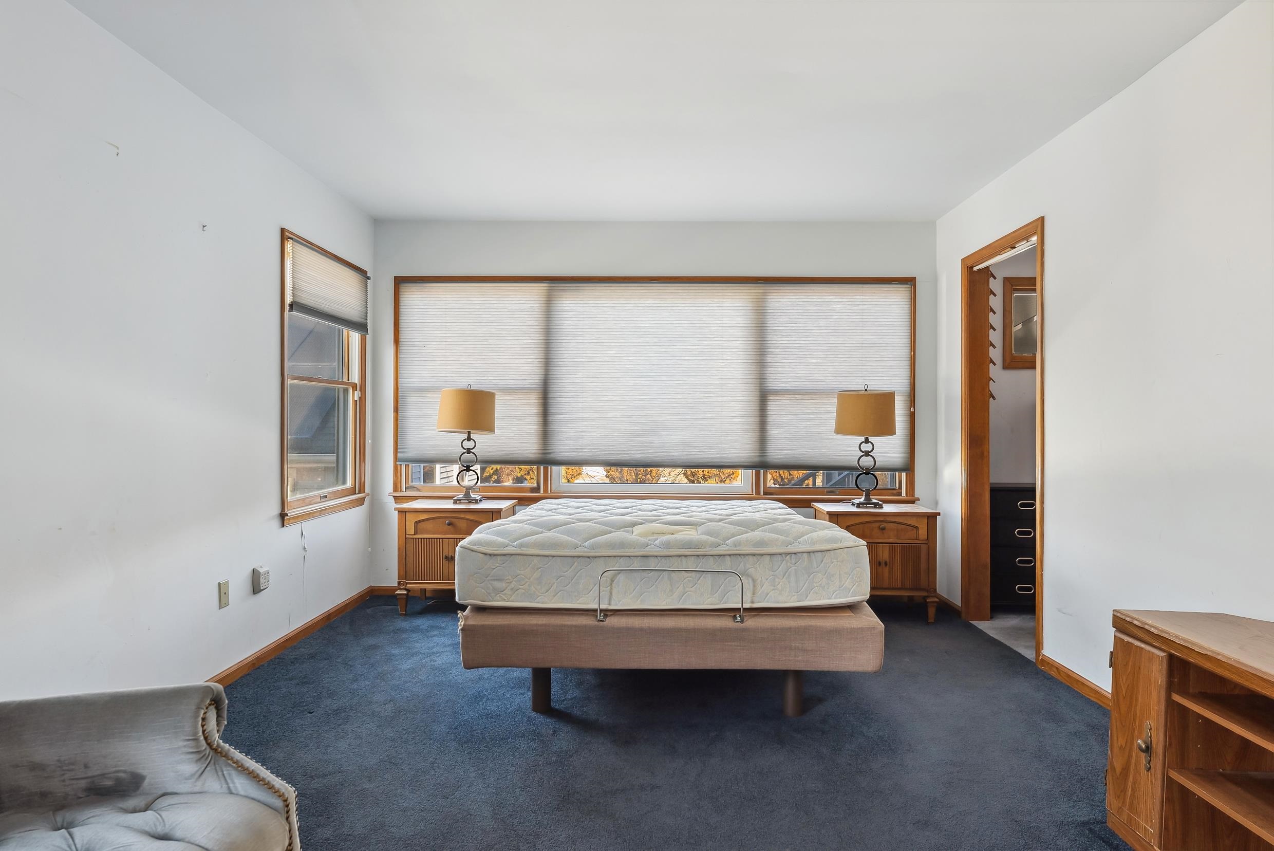401 4th West Cape May, NJ 08204 - Photo 20 of 43 a bed sitting in a spacious bedroom next to a window