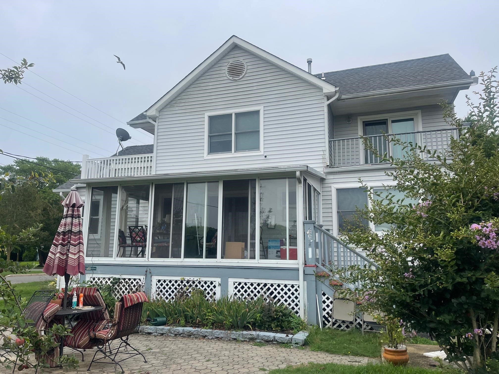 401 4th West Cape May, NJ 08204 - Photo 2 of 43 a view of a house with a garden