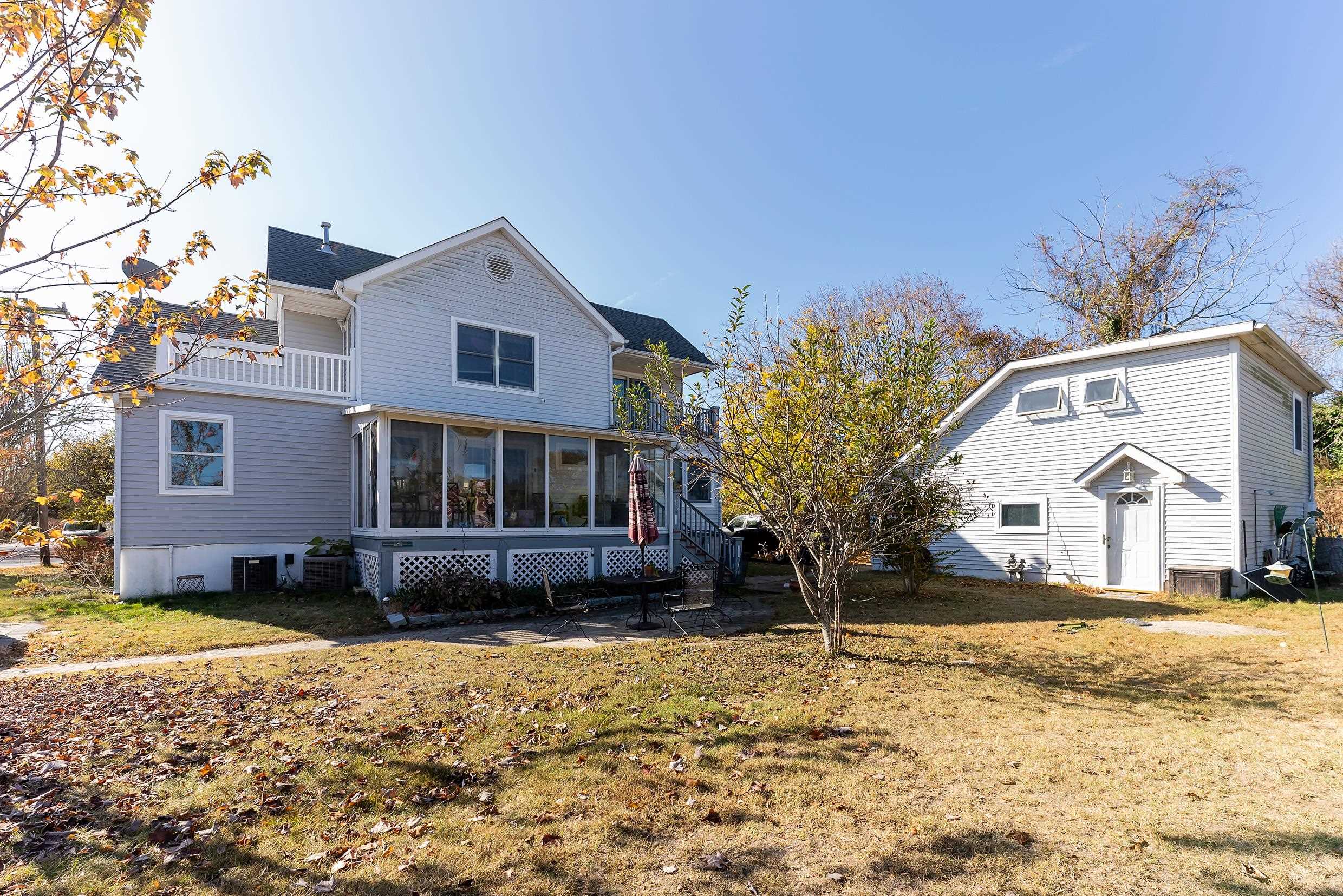 401 4th West Cape May, NJ 08204 - Photo 3 of 43 a front view of a house with a yard