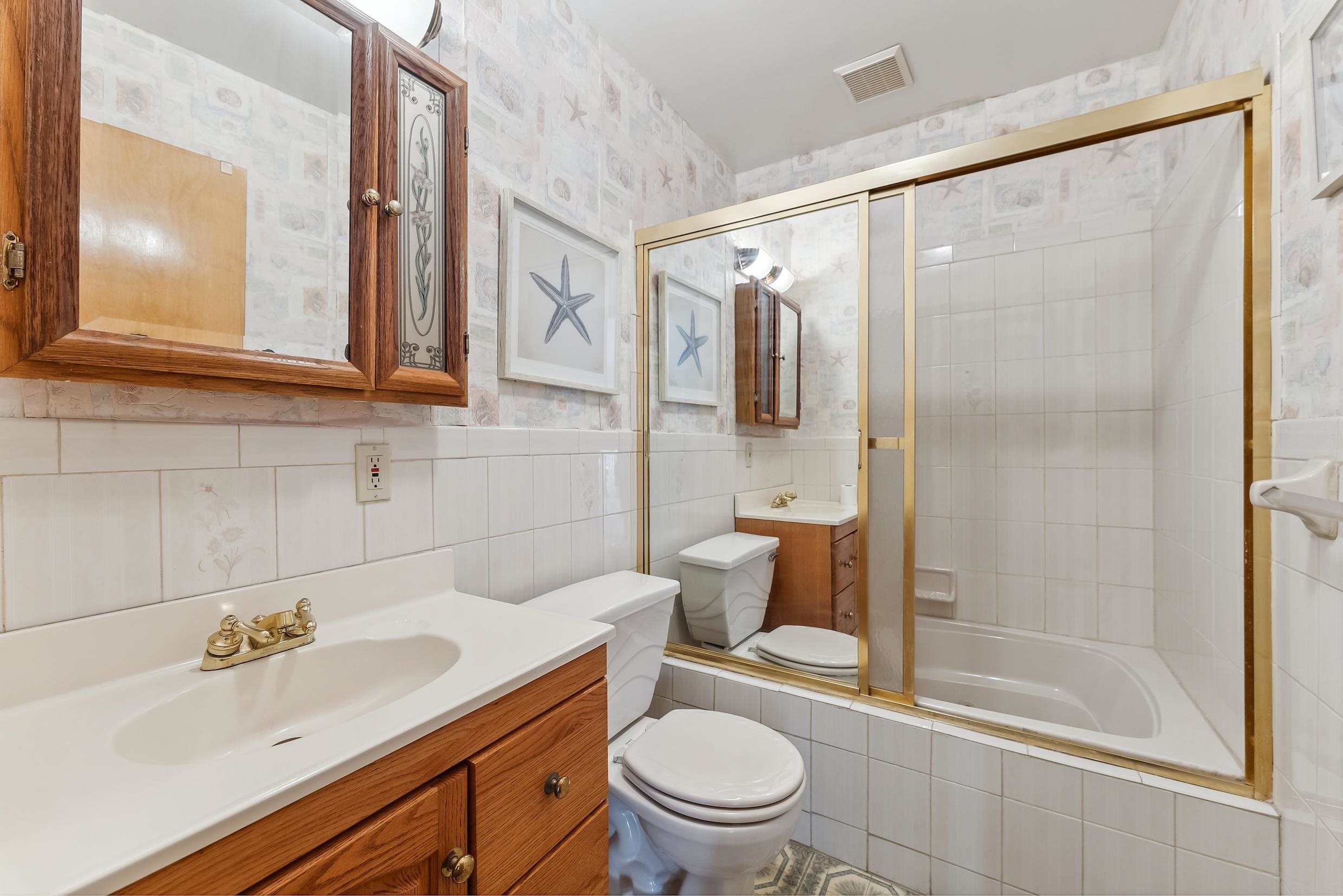 401 4th West Cape May, NJ 08204 - Photo 33 of 43 a bathroom with a sink a toilet and shower