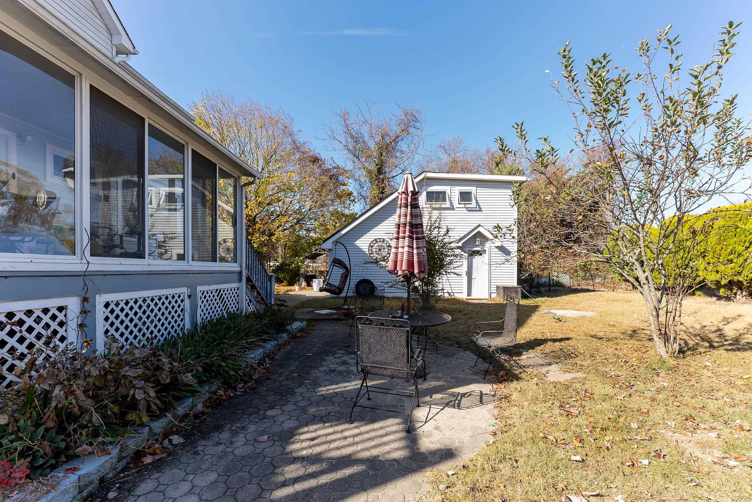 401 4th West Cape May, NJ 08204 - Photo 4 of 43 a view of a house with a yard