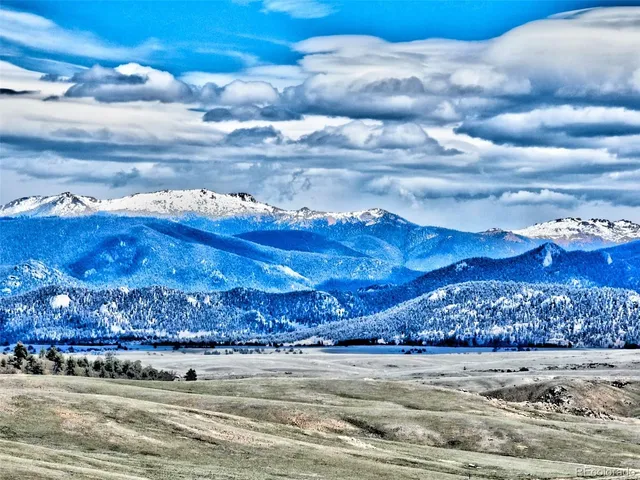 a large body of water with a building in the background