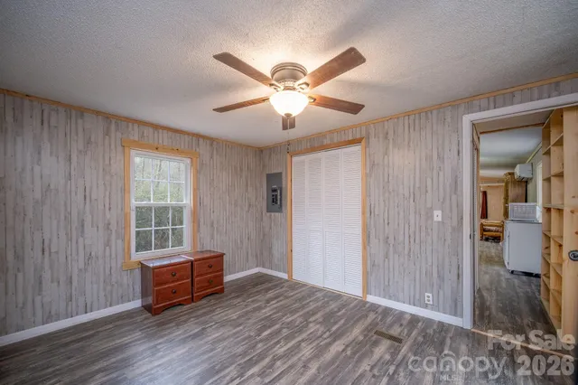 a view of room with window and ceiling fan