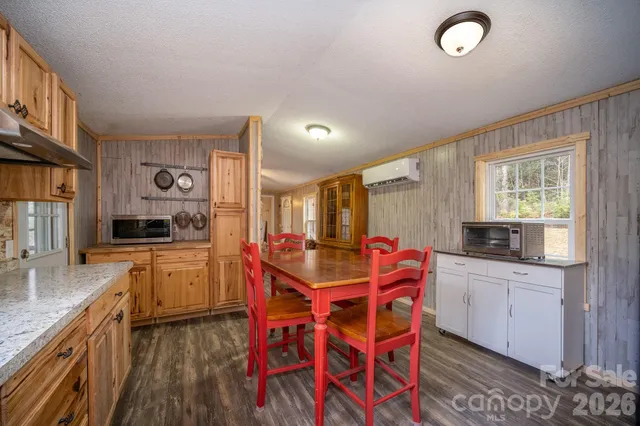 a kitchen with stainless steel appliances kitchen island granite countertop a sink and cabinets