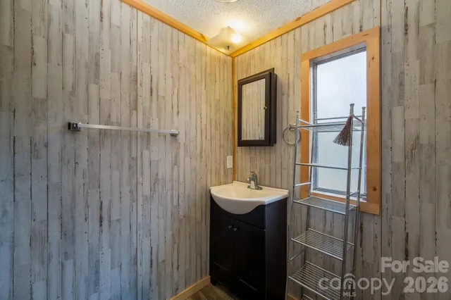 a bathroom with a sink and mirror