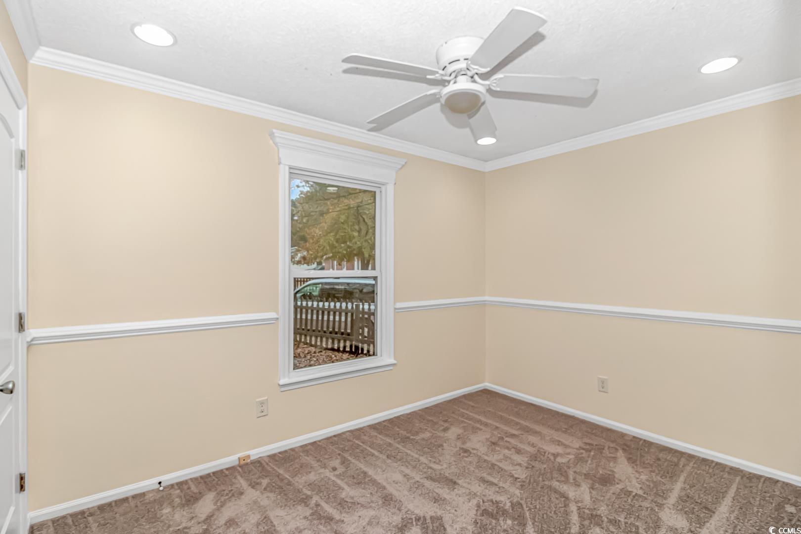 918 Forest Loop Road Conway, SC 29527 - Photo 16 of 26 Carpeted empty room with ceiling fan and ornamenta