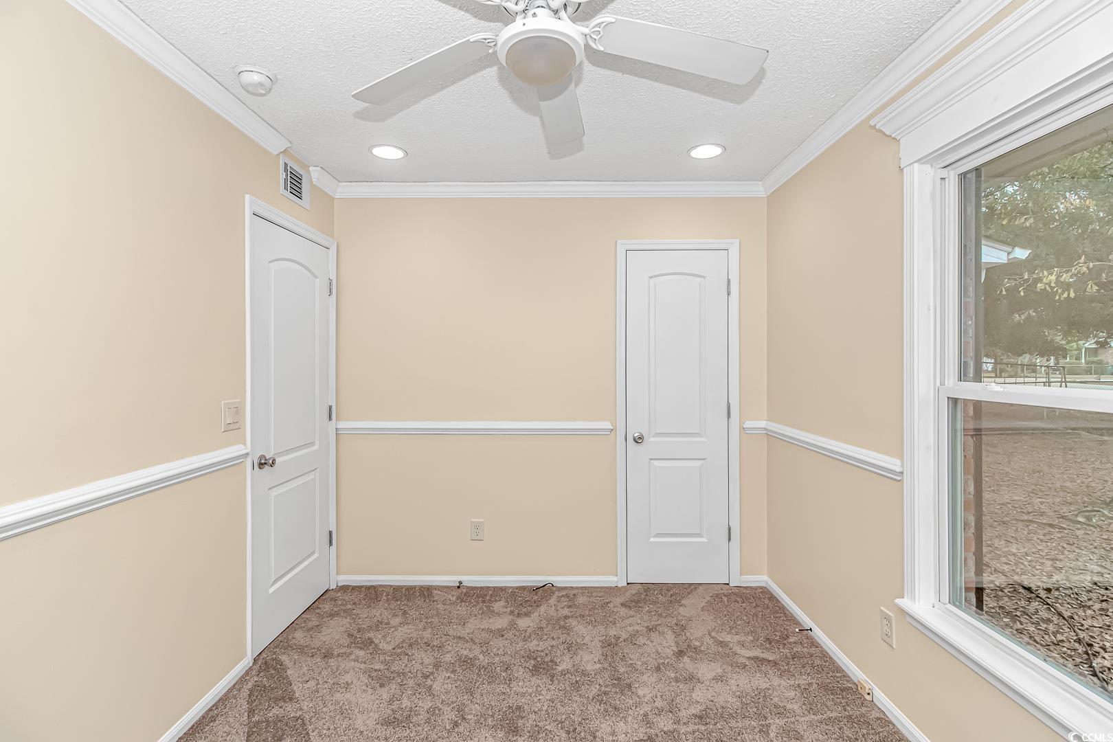 918 Forest Loop Road Conway, SC 29527 - Photo 17 of 26 Empty room with crown molding, light colored carpe