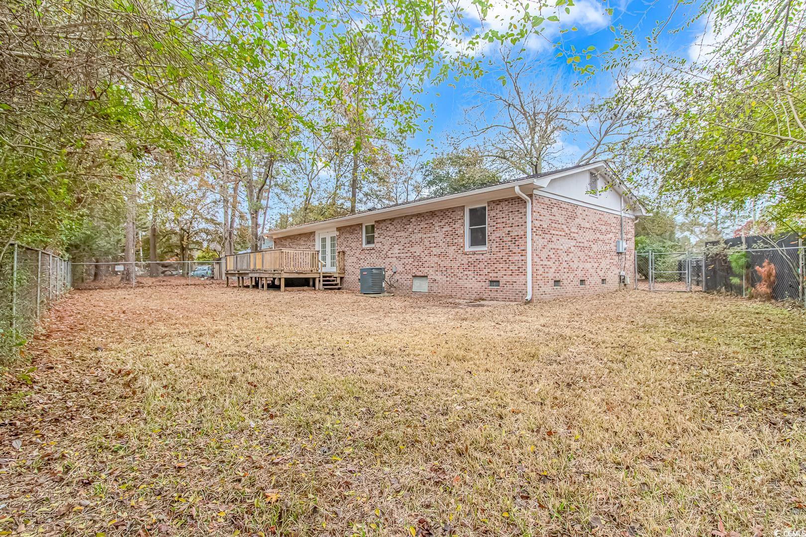 918 Forest Loop Road Conway, SC 29527 - Photo 21 of 26 Rear view of property featuring a lawn, central AC