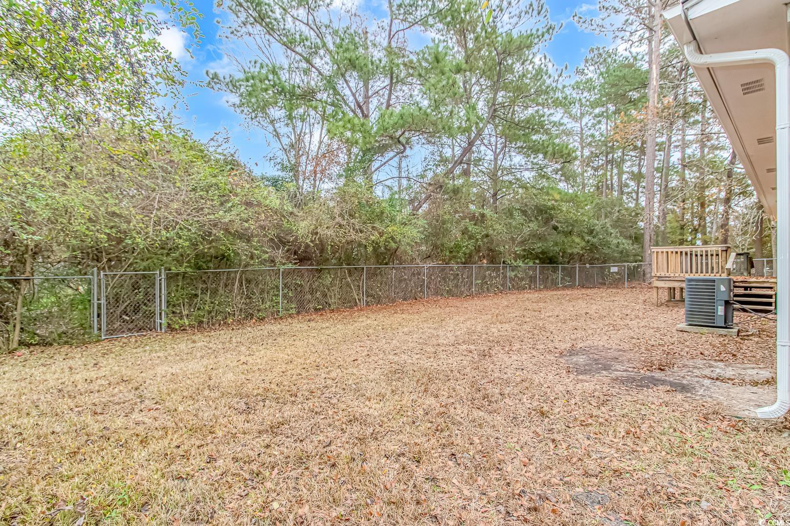 918 Forest Loop Road Conway, SC 29527 - Photo 24 of 26 View of yard with central AC and a deck