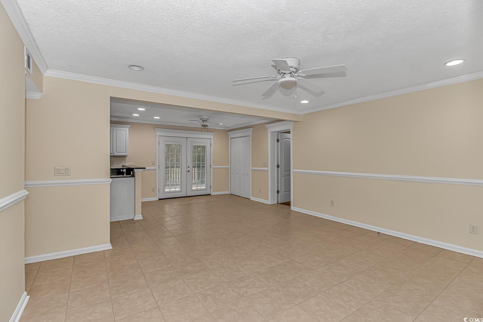 918 Forest Loop Road Conway, SC 29527 - Photo 3 of 26 Unfurnished living room with crown molding, french