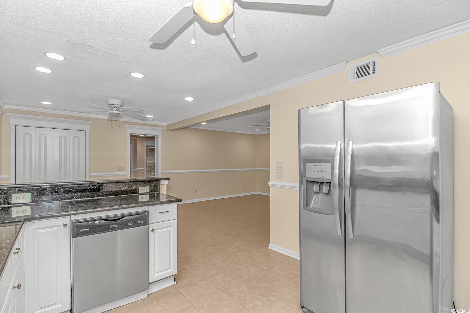 918 Forest Loop Road Conway, SC 29527 - Photo 6 of 26 Kitchen with white cabinetry, dark stone counterto