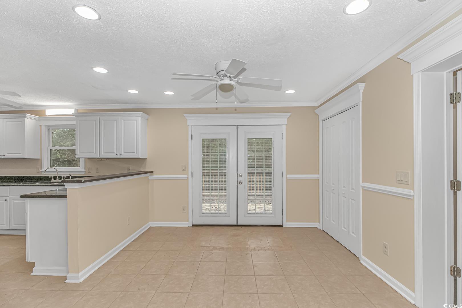 918 Forest Loop Road Conway, SC 29527 - Photo 8 of 26 Kitchen featuring french doors, white cabinets, ce