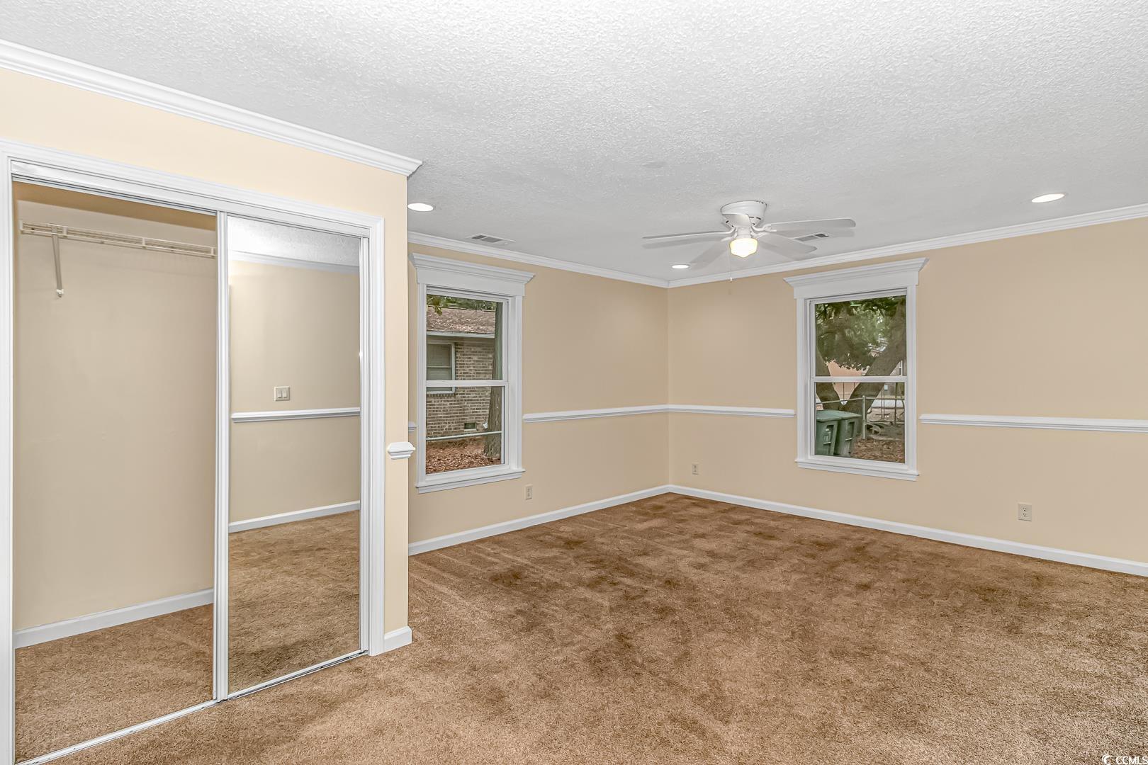 918 Forest Loop Road Conway, SC 29527 - Photo 9 of 26 Unfurnished bedroom with a textured ceiling, a clo