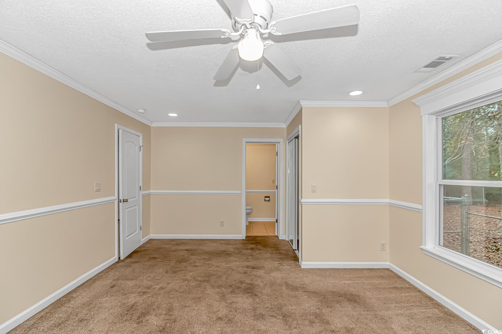 918 Forest Loop Road Conway, SC 29527 - Photo 10 of 26 Empty room with a wealth of natural light, light c