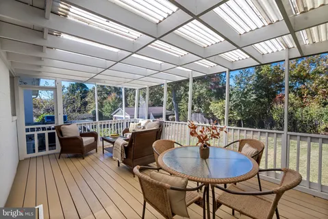 a dining room with furniture wooden floor and a garden