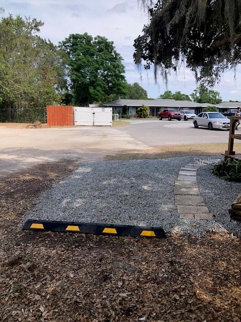 1401 East Alfred Street, Unit 9 Tavares, FL 32778 - Photo 14 of 18 a view of a yard with an outdoor space
