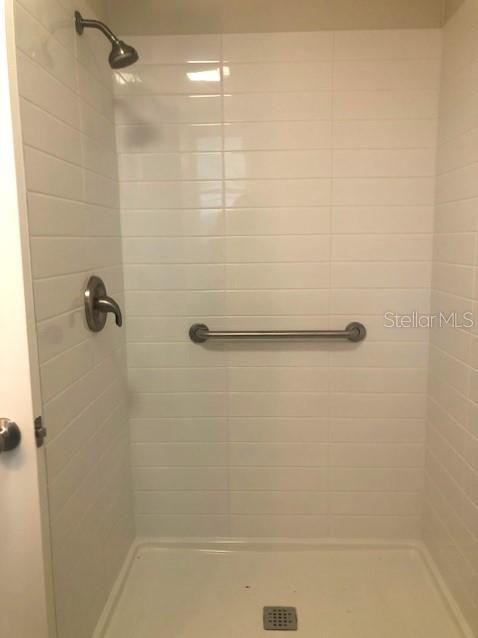 1401 East Alfred Street, Unit 9 Tavares, FL 32778 - Photo 8 of 18 a bathroom with a shower