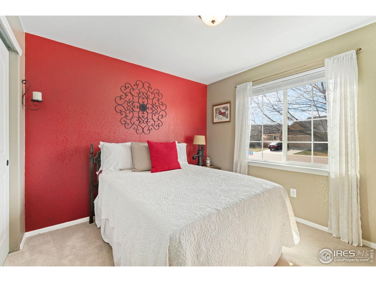 11420 Coal Ridge Street Firestone, CO 80504 - Photo 14 of 31 a bedroom with a bed and a large window