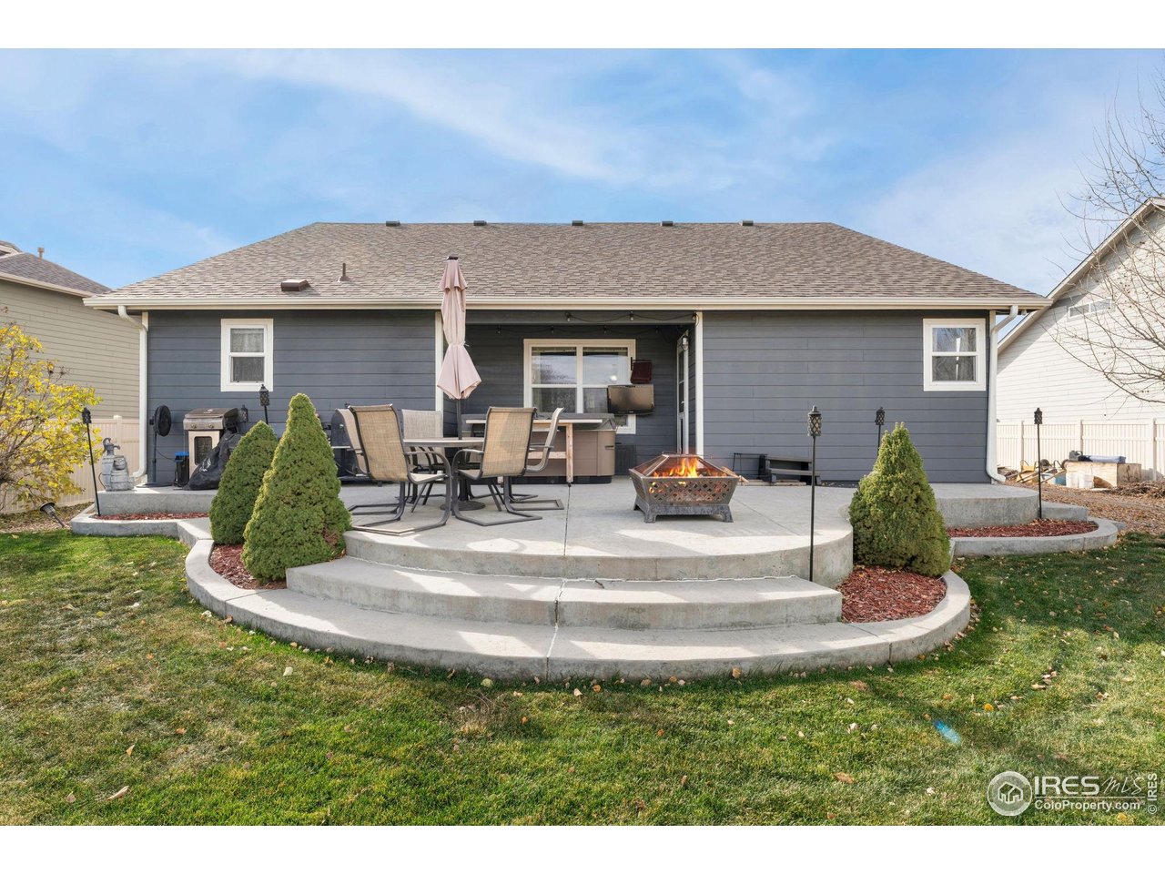 11420 Coal Ridge Street Firestone, CO 80504 - Photo 18 of 31 a view of a house with backyard and trees