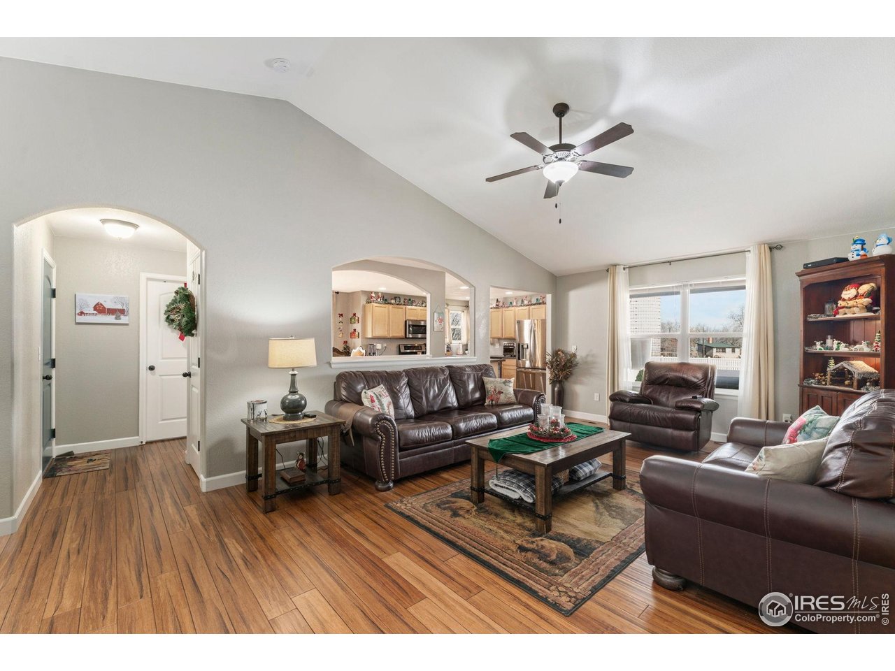 11420 Coal Ridge Street Firestone, CO 80504 - Photo 5 of 31 a living room with furniture and a wooden floor