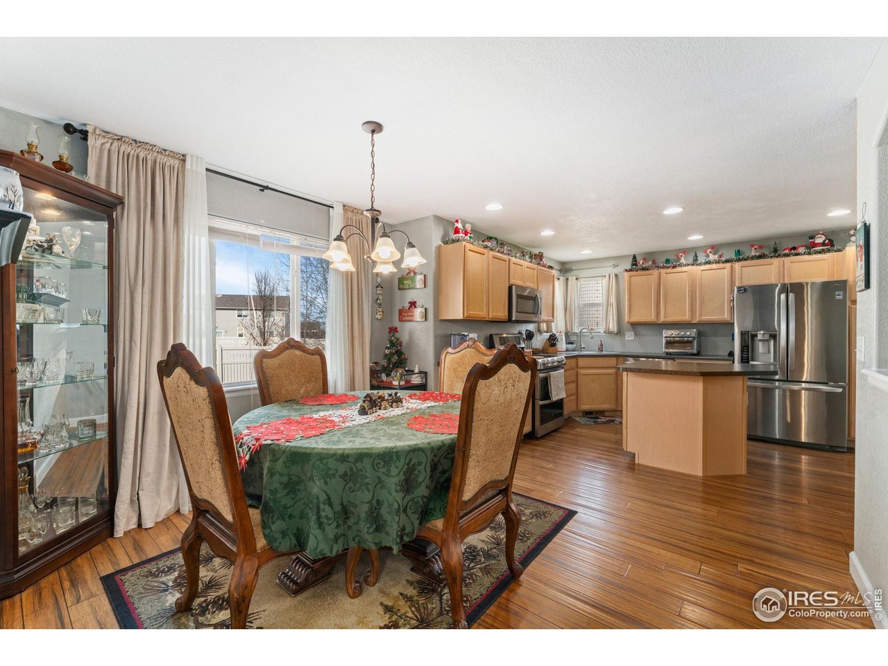 11420 Coal Ridge Street Firestone, CO 80504 - Photo 10 of 31 a living room with furniture and kitchen view