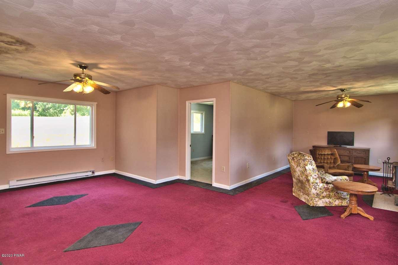 5690 Haas Pond Road Moscow, PA 18444 - Photo 33 of 79 a livingroom with furniture and a window