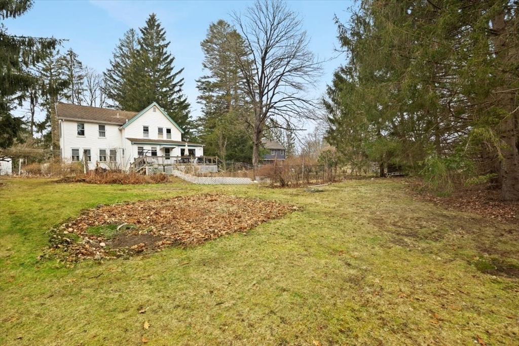 7 Shufelt Road South Walpole, MA 02071 - Photo 20 of 22 a view of a house with a big yard and large trees