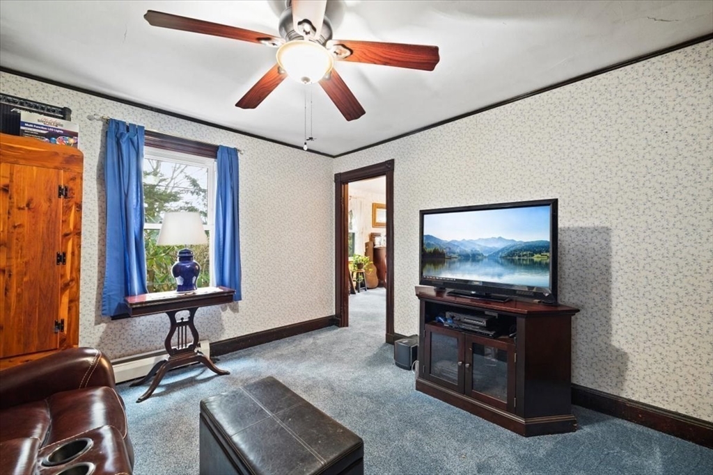 7 Shufelt Road South Walpole, MA 02071 - Photo 9 of 22 a living room with furniture and a flat screen tv