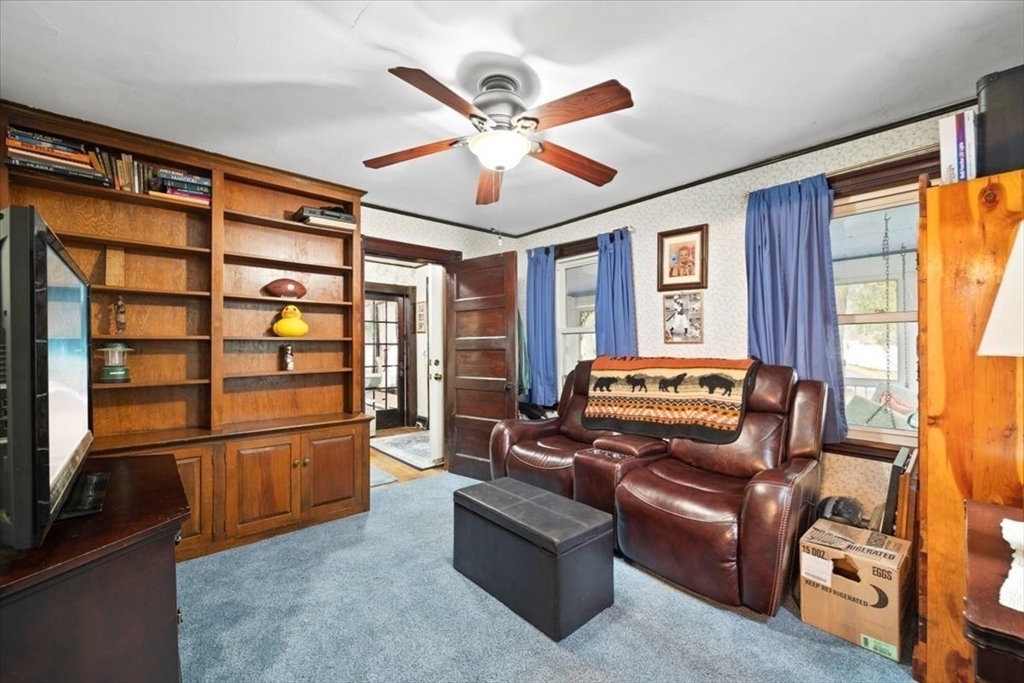 7 Shufelt Road South Walpole, MA 02071 - Photo 10 of 22 a living room with furniture a ceiling fan and a window