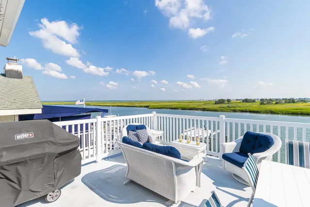 a view of a chairs and table in patio