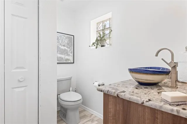a view of a bathroom with a toilet and a sink