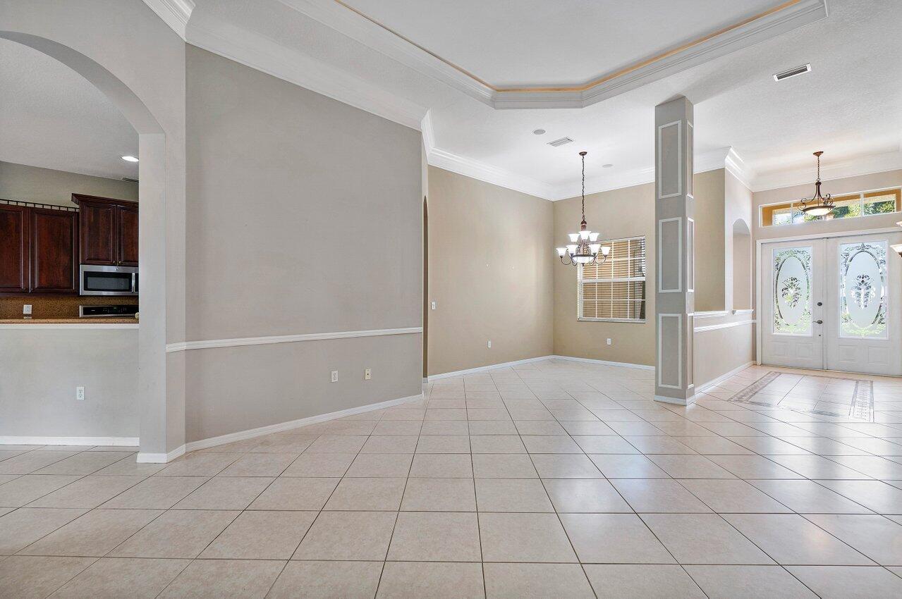 521 Southwest Lake Manatee Way Port St. Lucie, FL 34986 - Photo 11 of 33 a view of a livingroom with a furniture and an entryway