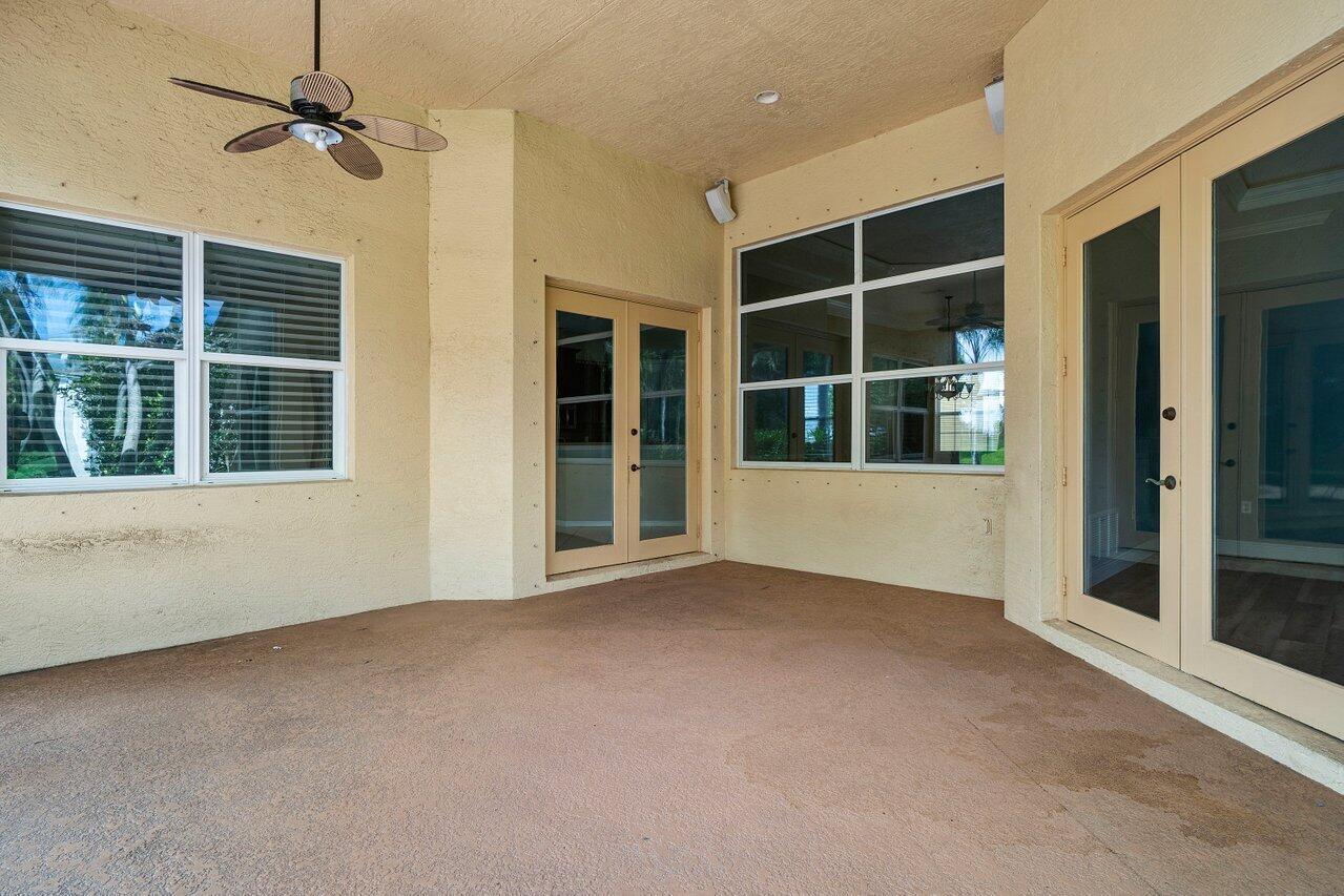 521 Southwest Lake Manatee Way Port St. Lucie, FL 34986 - Photo 28 of 33 an empty room with windows