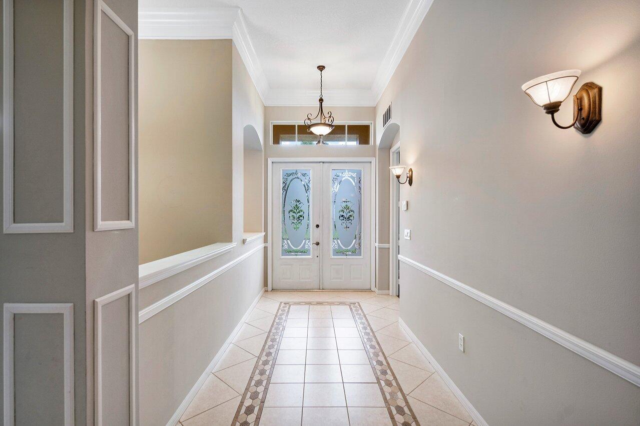 521 Southwest Lake Manatee Way Port St. Lucie, FL 34986 - Photo 4 of 33 a bathroom with a bathtub and a shower