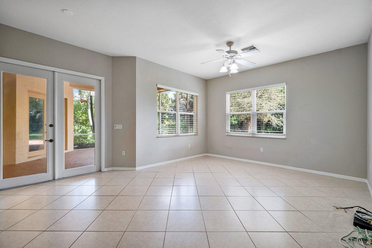 521 Southwest Lake Manatee Way Port St. Lucie, FL 34986 - Photo 9 of 33 a view of an empty room with a window
