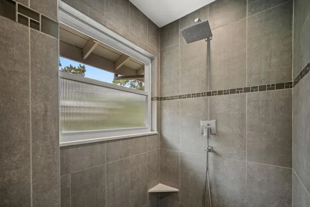 a bathroom with a glass shower door